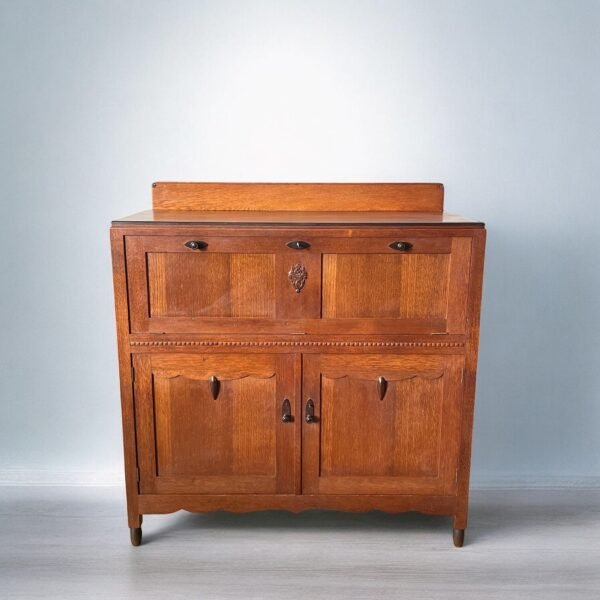 An antique oak secretary cabinet